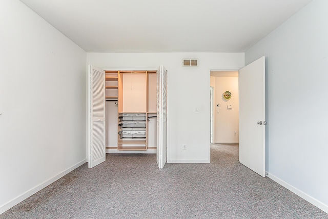2277 W Huron River Dr, Ann Arbor, MI 48103 - unfurnished bedroom with carpet flooring and a closet
