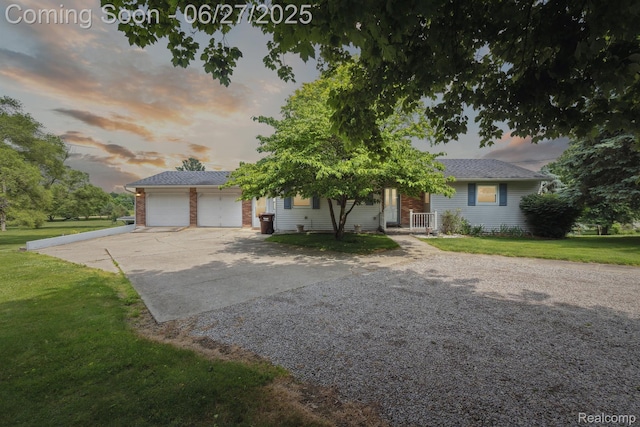 15501 Turner, Lansing, MI 48906 - obstructed view of property with driveway, a front lawn, and a garage