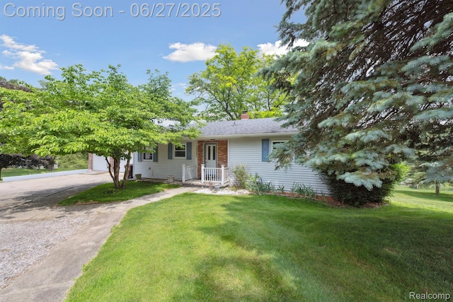 15501 Turner, Lansing, MI 48906 - single story home featuring a front lawn, a chimney, concrete driveway, and a garage