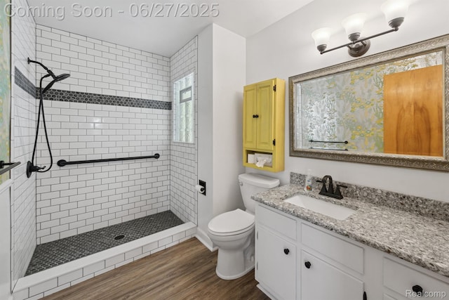 15501 Turner, Lansing, MI 48906 - bathroom featuring a tile shower, vanity, and wood finished floors