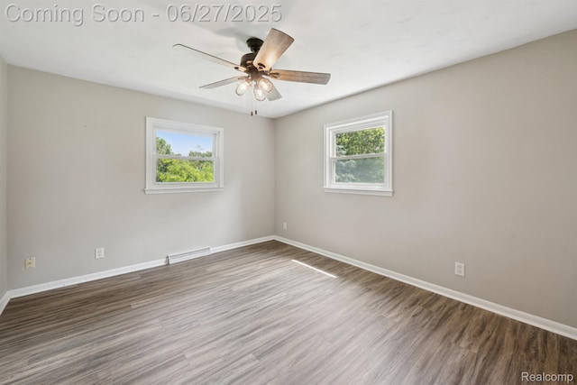 15501 Turner, Lansing, MI 48906 - spare room with wood finished floors, ceiling fan, and a baseboard heating unit