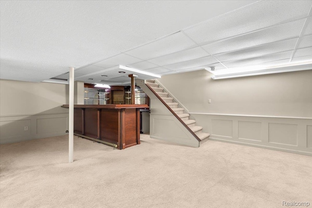 18068 Autumn Ln, Macomb, MI 48044 - finished basement featuring a dry bar, carpet flooring, stairs, a decorative wall, and wainscoting