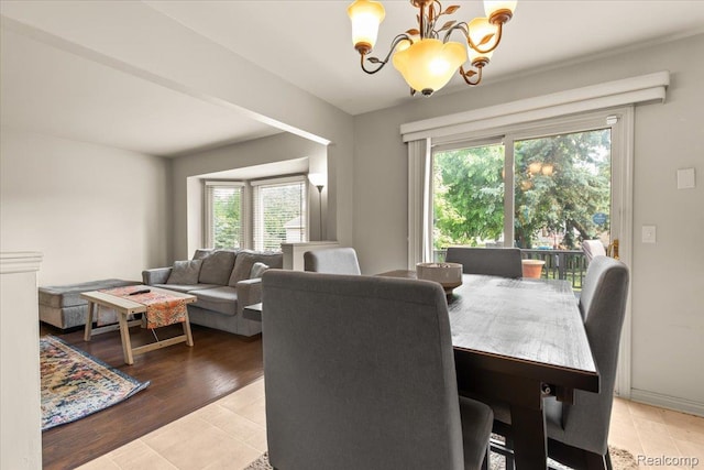18068 Autumn Ln, Macomb, MI 48044 - dining area with a chandelier and light tile patterned floors