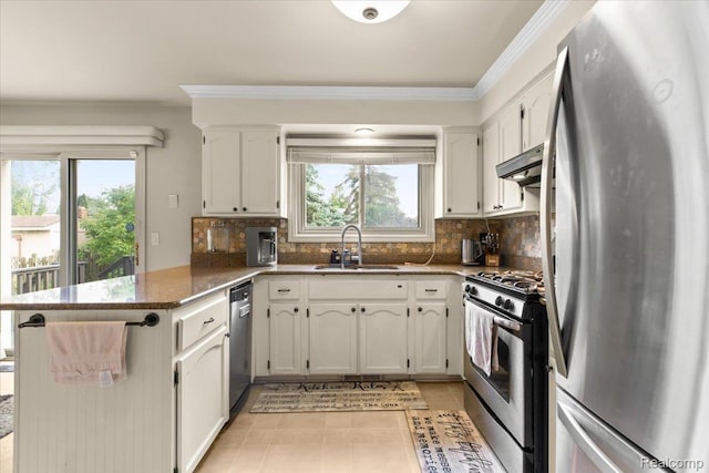 18068 Autumn Ln, Macomb, MI 48044 - kitchen featuring appliances with stainless steel finishes, a peninsula, plenty of natural light, ornamental molding, and decorative backsplash