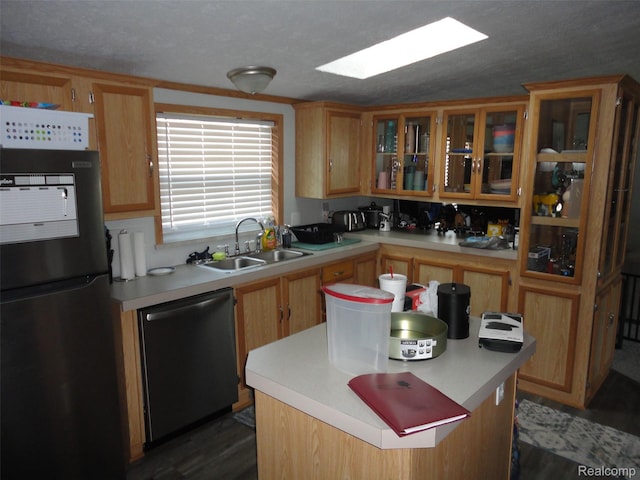 453 Glencoe Dr, Temperance, MI 48182 - kitchen featuring freestanding refrigerator, dishwashing machine, light countertops, a center island, and glass insert cabinets