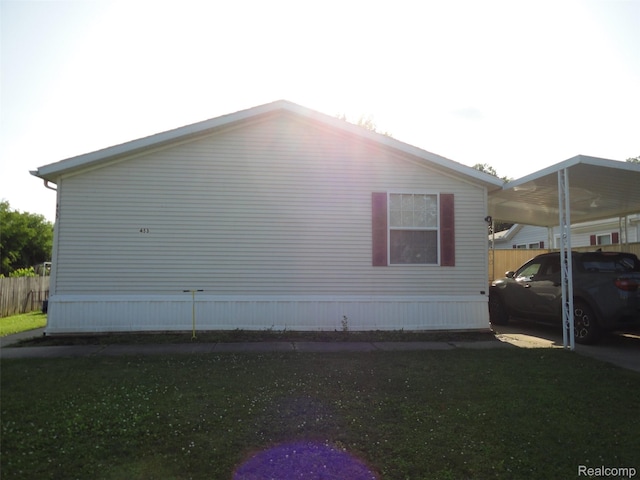 453 Glencoe Dr, Temperance, MI 48182 - view of side of home featuring a carport