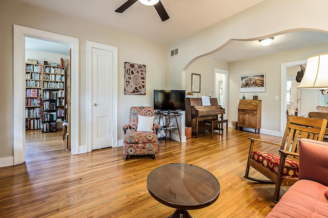 809 Pauline Blvd, Ann Arbor, MI 48103 - living room featuring arched walkways, a ceiling fan, and light wood finished floors