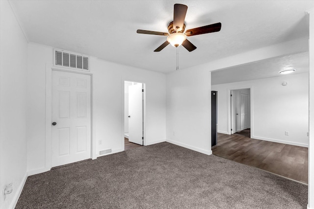 521 E Morrell St, Otsego, MI 49078 - unfurnished bedroom featuring dark carpet and a ceiling fan