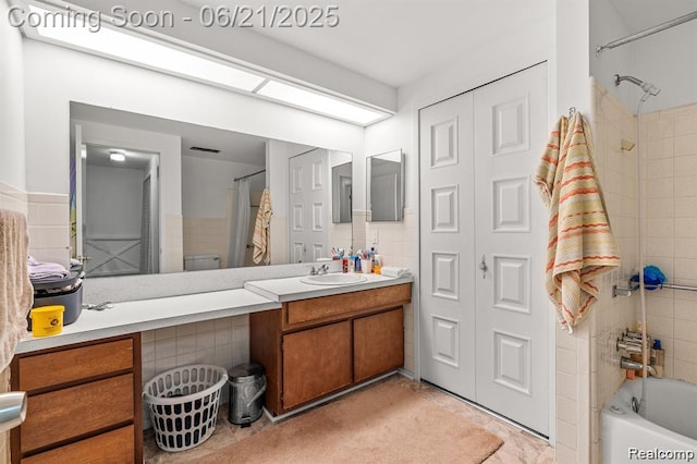 29636 City Center Dr, Warren, MI 48093 - full bathroom featuring shower / bathtub combination with curtain, vanity, and tile walls