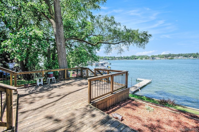 2058 S Long Lake Rd, Fenton, MI 48430 - wooden terrace with a water view and a floating dock
