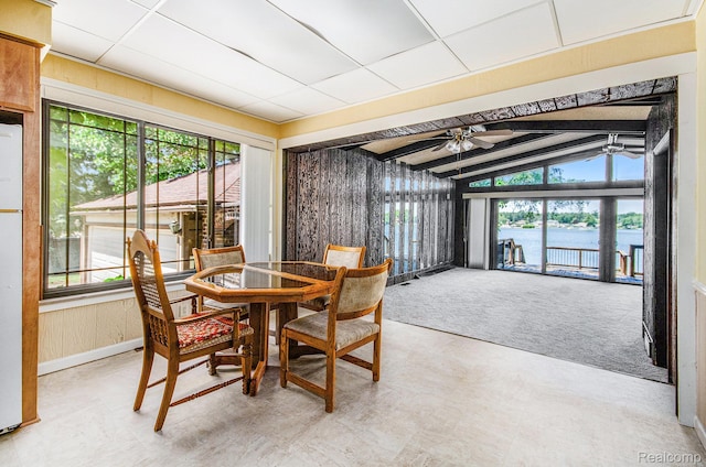 2058 S Long Lake Rd, Fenton, MI 48430 - dining space with ceiling fan, vaulted ceiling, and a water view