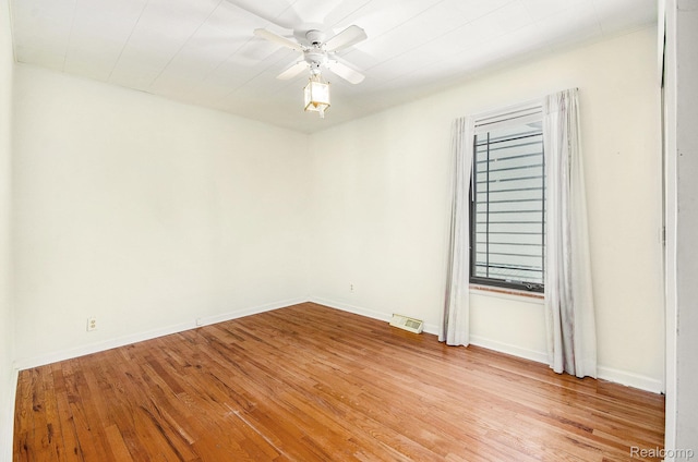 2058 S Long Lake Rd, Fenton, MI 48430 - unfurnished room featuring light wood-style floors and ceiling fan