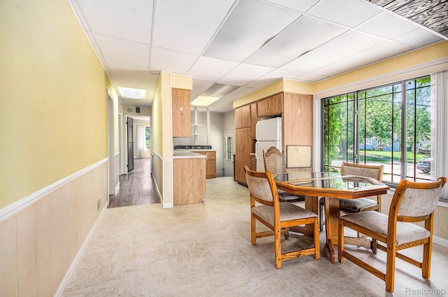 2058 S Long Lake Rd, Fenton, MI 48430 - dining room featuring healthy amount of natural light, wainscoting, and a paneled ceiling