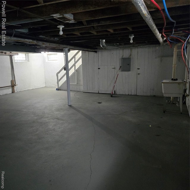 4670 Devonshire Rd, Detroit, MI 48224 - unfinished basement featuring electric panel and a sink