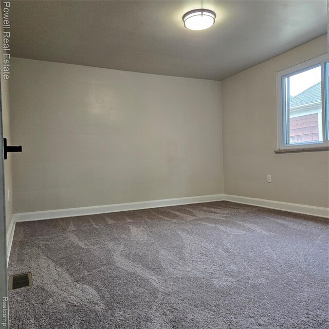 4670 Devonshire Rd, Detroit, MI 48224 - carpeted empty room featuring baseboards