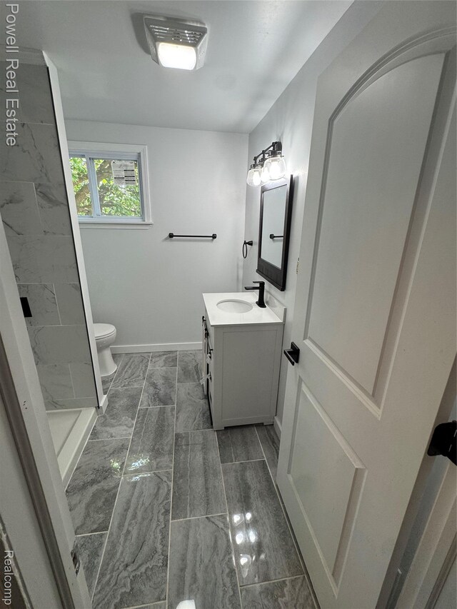 4670 Devonshire Rd, Detroit, MI 48224 - full bathroom featuring vanity, marble finish floors, and a shower