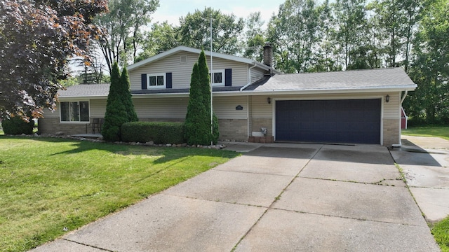 11427 Colonial Woods Dr, Clio, MI 48420 - tri-level home with brick siding, a garage, driveway, a front lawn, and a chimney