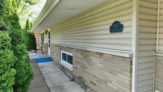 11427 Colonial Woods Dr, Clio, MI 48420 - view of side of property featuring brick siding