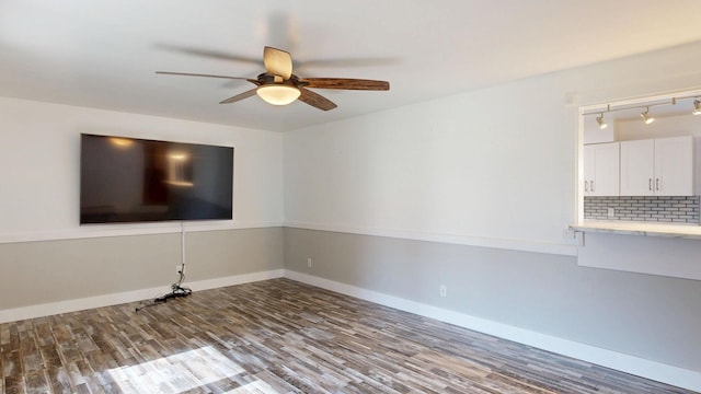 11427 Colonial Woods Dr, Clio, MI 48420 - unfurnished room with wood finished floors, ceiling fan, and rail lighting