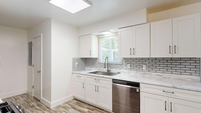 11427 Colonial Woods Dr, Clio, MI 48420 - kitchen featuring dishwasher, light wood-style floors, backsplash, white cabinets, and light stone countertops