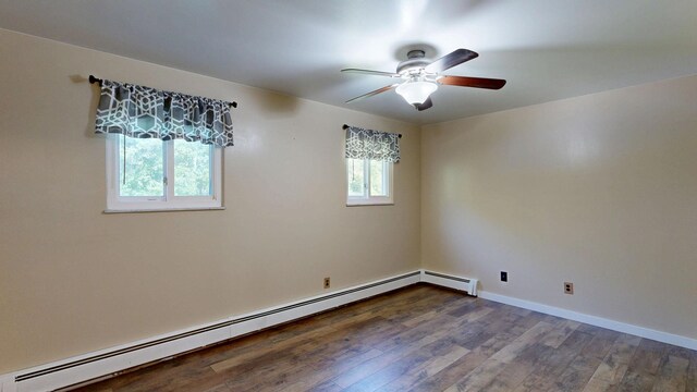 11427 Colonial Woods Dr, Clio, MI 48420 - spare room with a baseboard radiator, wood finished floors, and ceiling fan