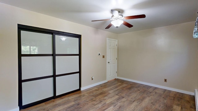 11427 Colonial Woods Dr, Clio, MI 48420 - empty room featuring ceiling fan and wood finished floors