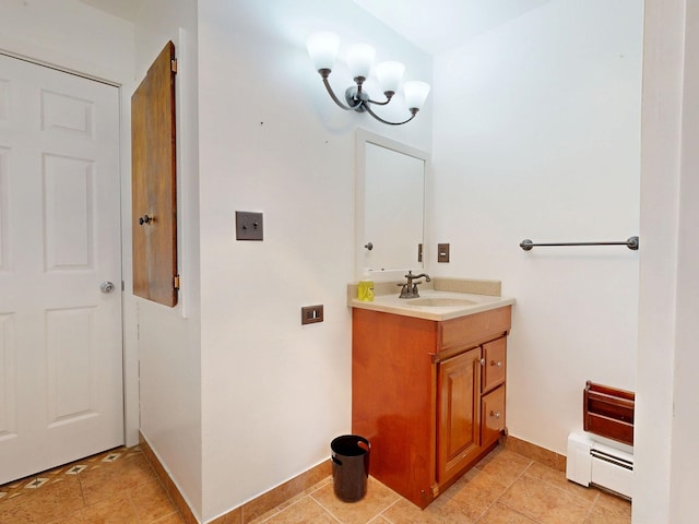 11427 Colonial Woods Dr, Clio, MI 48420 - bathroom with vanity, a baseboard radiator, and a chandelier