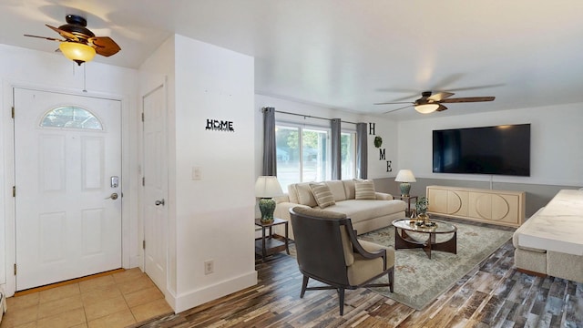 11427 Colonial Woods Dr, Clio, MI 48420 - living area featuring a ceiling fan and wood finished floors