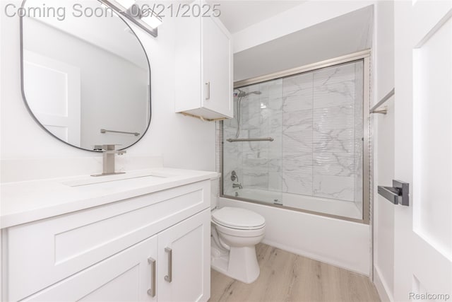 3145 Point Of The Woods Dr, West Bloomfield, MI 48324 - full bath featuring vanity, shower / bath combination with glass door, and wood finished floors