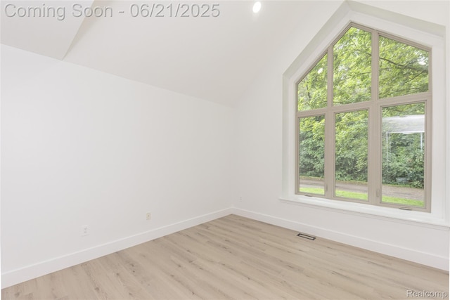 3145 Point Of The Woods Dr, West Bloomfield, MI 48324 - bonus room with light wood-style floors and vaulted ceiling