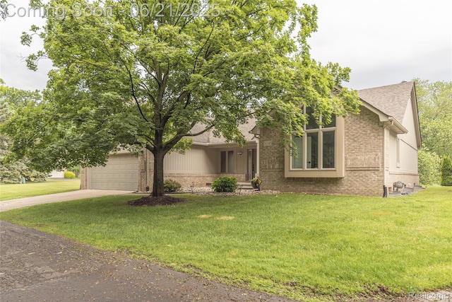 3145 Point Of The Woods Dr, West Bloomfield, MI 48324 - view of front facade featuring brick siding, driveway, roof with shingles, and a front yard