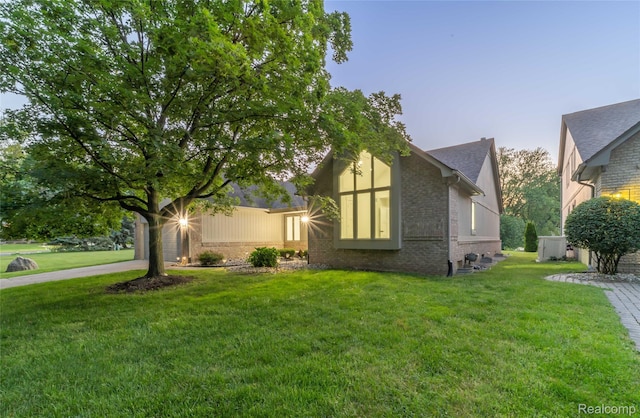 3145 Point Of The Woods Dr, West Bloomfield, MI 48324 - view of side of property featuring brick siding and a yard