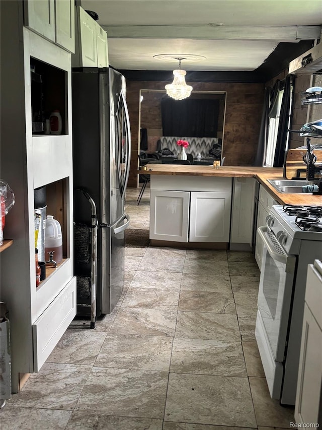 454 E Atherton Rd, Flint, MI 48507 - kitchen featuring freestanding refrigerator, wooden counters, white gas range oven, and a chandelier