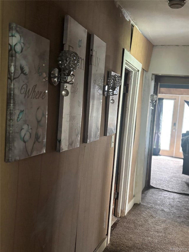 454 E Atherton Rd, Flint, MI 48507 - hall featuring carpet, wooden walls, and french doors