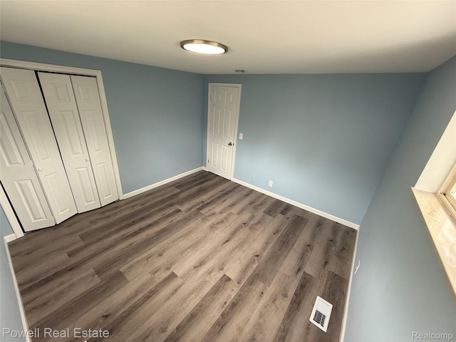 2326 Silver Cir, Pontiac, MI 48328 - unfurnished bedroom with dark wood-type flooring and a closet