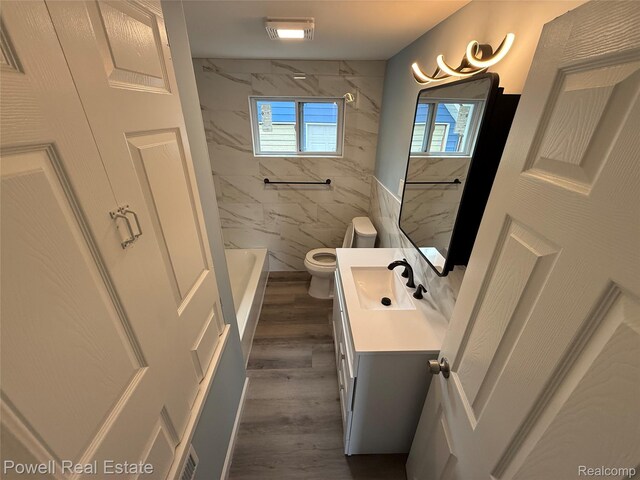 2326 Silver Cir, Pontiac, MI 48328 - bathroom featuring vanity, bathtub / shower combination, wood finished floors, and tile walls