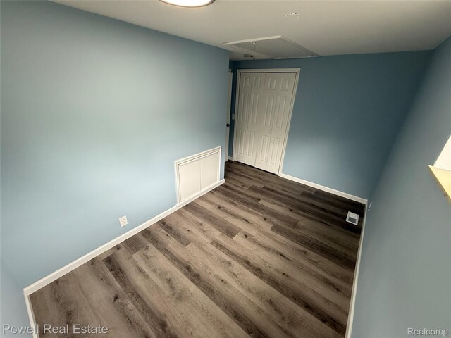 2326 Silver Cir, Pontiac, MI 48328 - empty room with attic access and wood finished floors