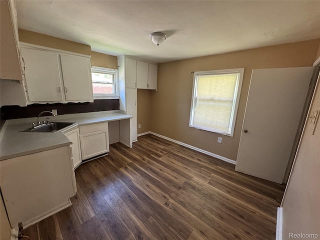 17370 Stout St, Detroit, MI 48219 - kitchen featuring white cabinets, dark wood-style floors, and light countertops