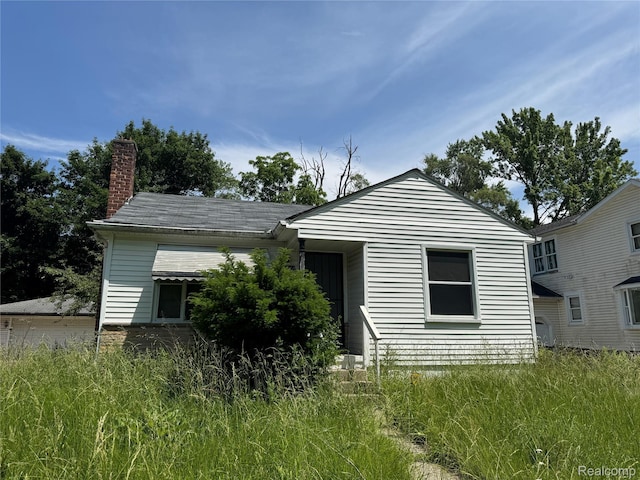 17370 Stout St, Detroit, MI 48219 - back of property featuring a chimney