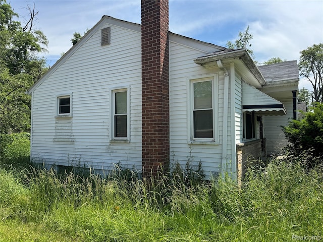 17370 Stout St, Detroit, MI 48219 - view of home's exterior featuring a chimney