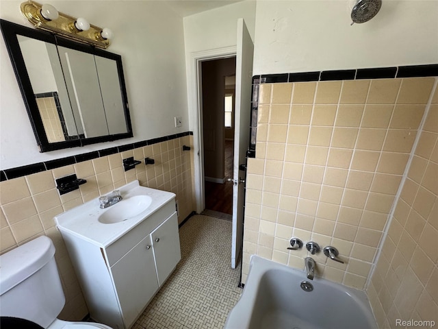 17370 Stout St, Detroit, MI 48219 - bathroom with tile walls, a bath, vanity, a wainscoted wall, and tile patterned floors