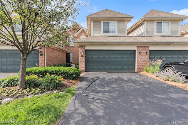 417 James Cir, Royal Oak, MI 48067 - traditional-style house featuring an attached garage, driveway, and brick siding