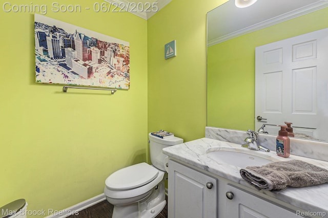 417 James Cir, Royal Oak, MI 48067 - half bathroom featuring crown molding, vanity, and wood finished floors