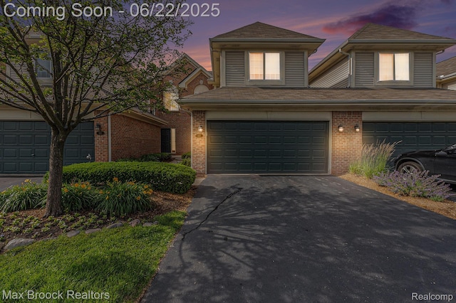 417 James Cir, Royal Oak, MI 48067 - traditional-style home featuring asphalt driveway, a garage, and brick siding