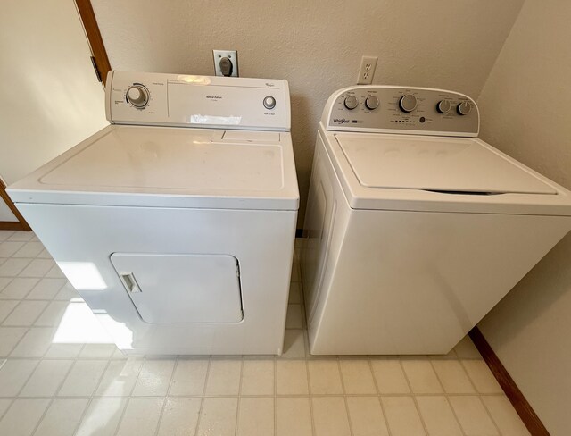 8021 Mclain Ave, Lambertville, MI 48144 - washroom with washing machine and dryer and a textured wall