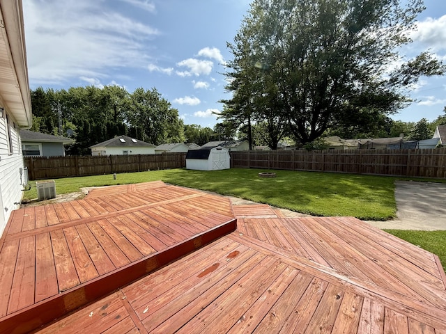 8021 Mclain Ave, Lambertville, MI 48144 - wooden terrace featuring a fenced backyard and a storage unit