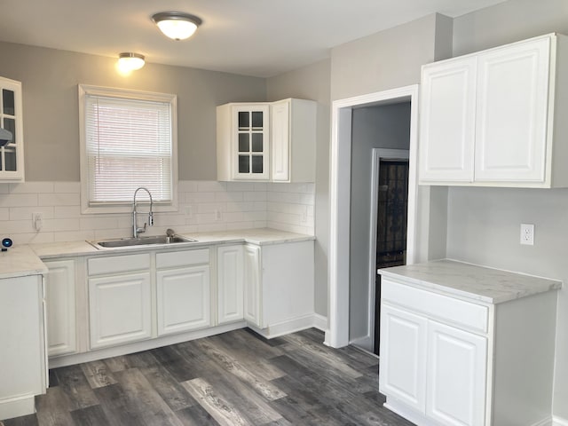 11751 Engleside St, Detroit, MI 48205 - kitchen with glass insert cabinets, tasteful backsplash, and white cabinetry