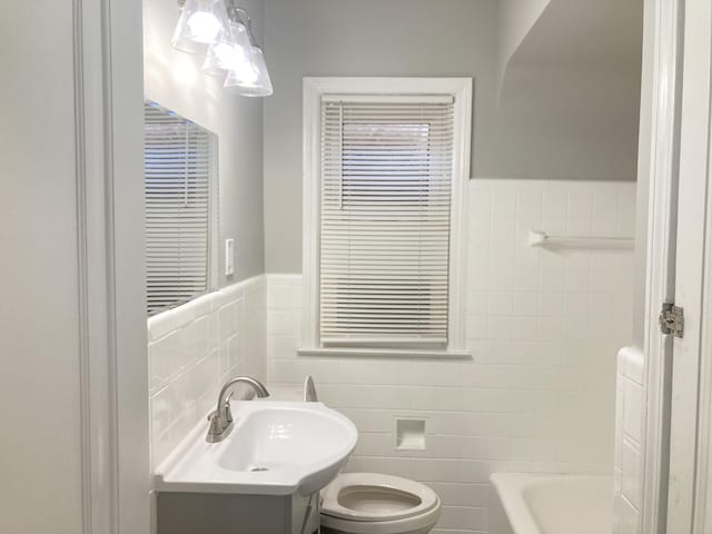 11751 Engleside St, Detroit, MI 48205 - bathroom with tile walls, vanity, and wainscoting