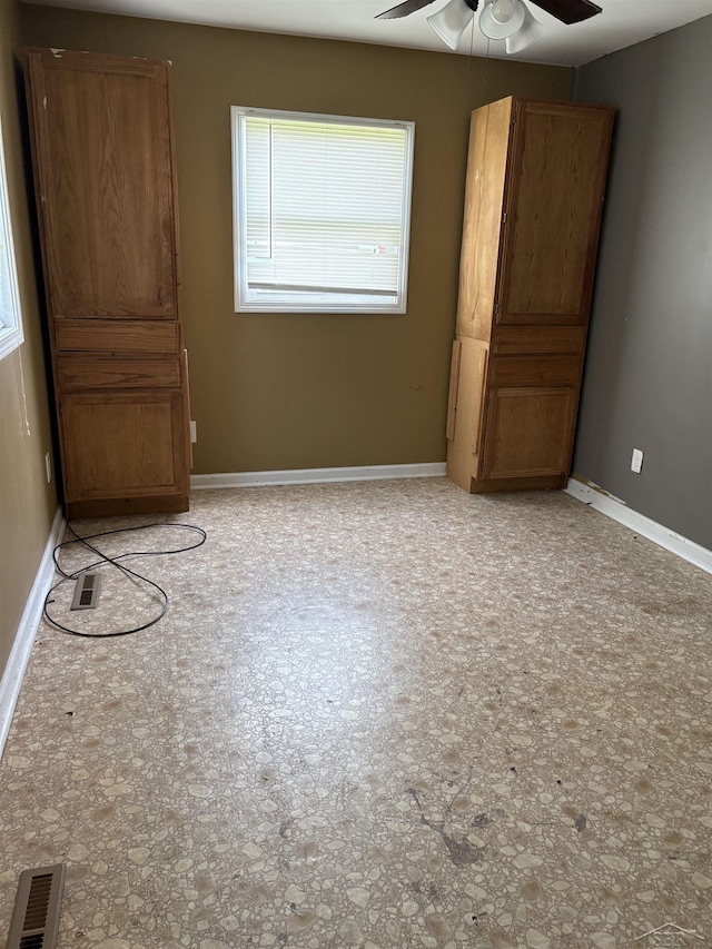644 S 26th St, Saginaw, MI 48601 - unfurnished bedroom featuring baseboards and ceiling fan