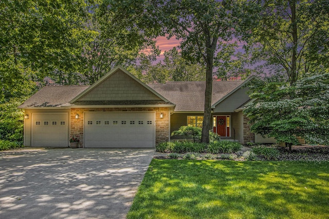 3314 Westview Ct, Allegan, MI 49010 - view of front of property with an attached garage, driveway, a front lawn, and roof with shingles